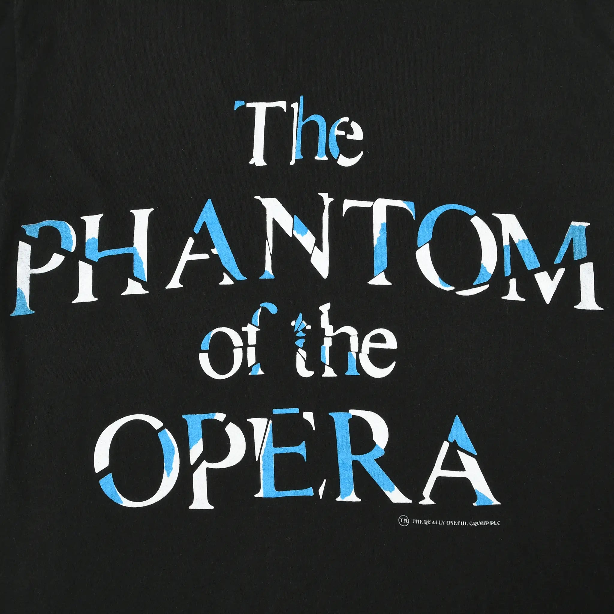 Close-up of blue and white The Phantom of the Opera front print