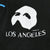 Close-up of white Phantom mask and Los Angeles sleeve print