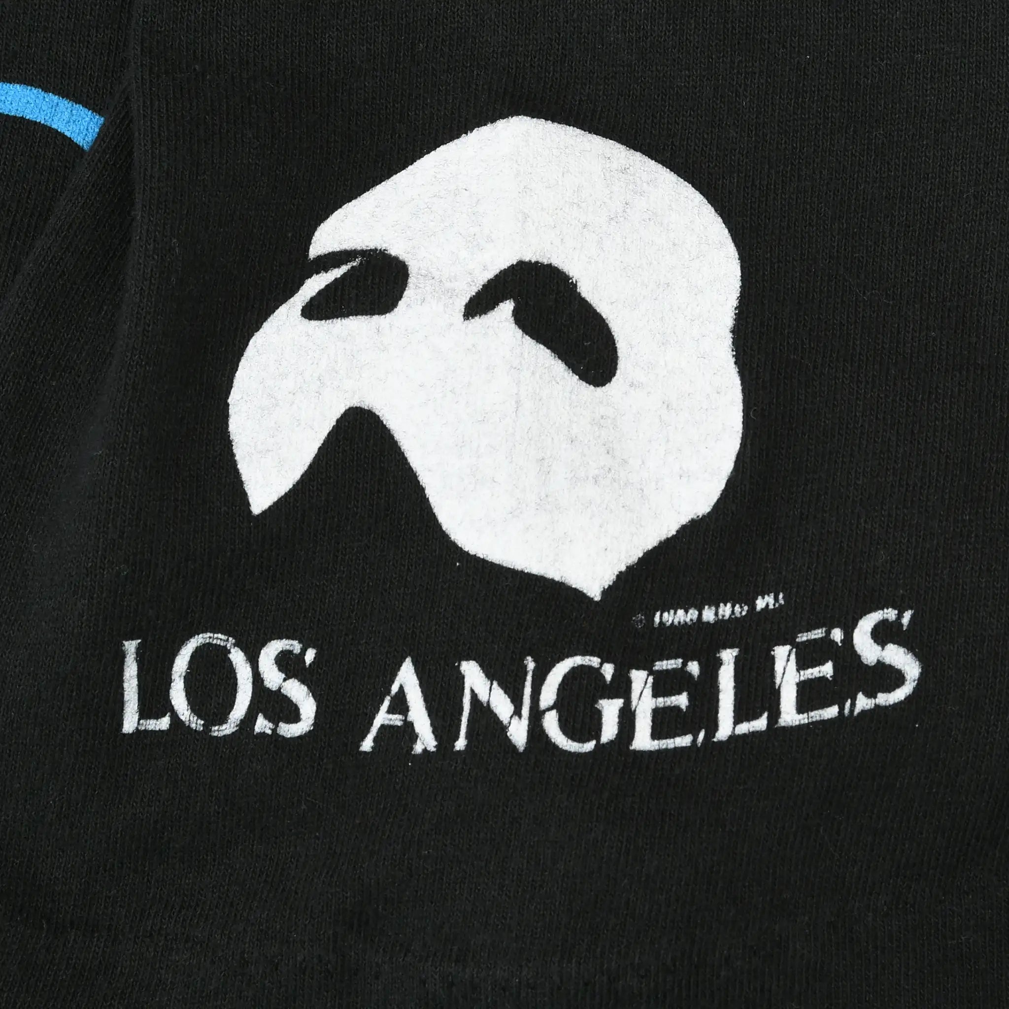 Close-up of white Phantom mask and Los Angeles sleeve print