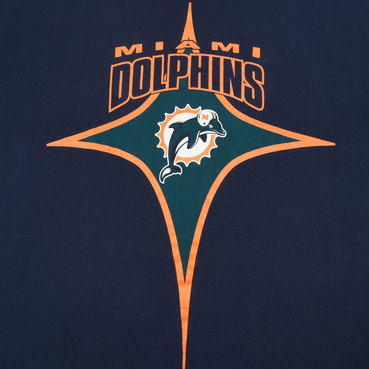 Close-up of orange and teal Miami Dolphins logo print on navy fabric