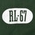 Close-up of cracked white RL-67 sleeve print on green fabric