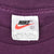 Nike neck tag with Swoosh logo, size L and Made in USA text