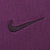 Close-up of dark Nike Swoosh embroidery on purple fabric