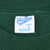 Velva Sheen Adult L Made in U.S.A. neck label on dark green T-shirt