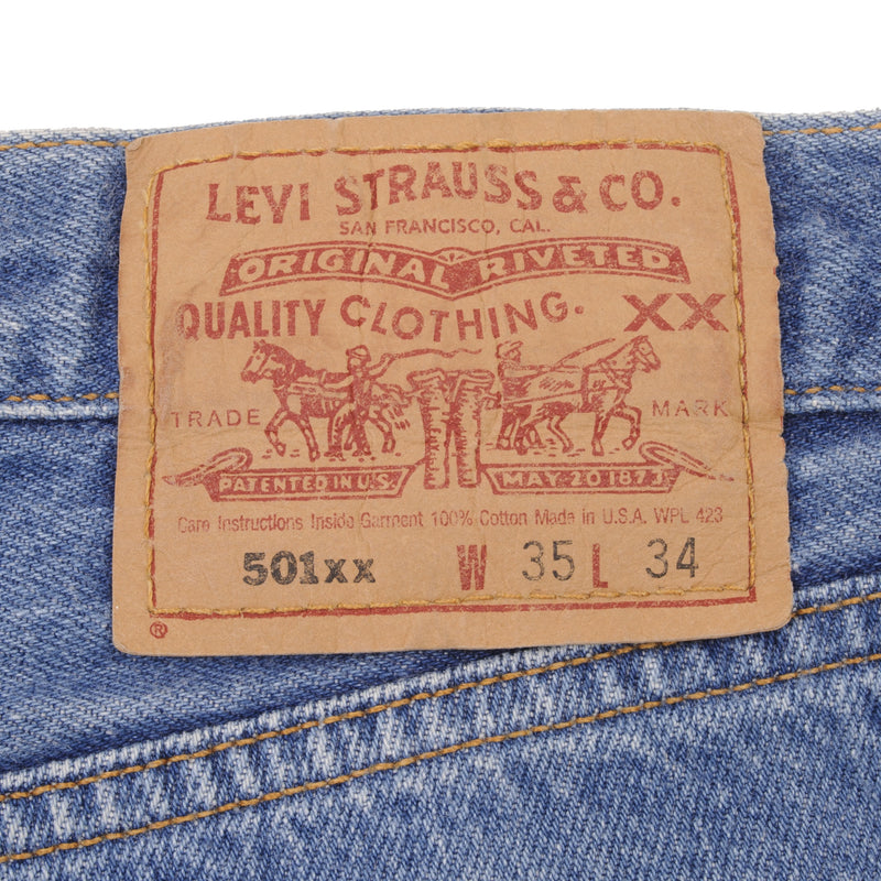 Beautiful Indigo Levis 501 Jeans 1990s Made in USA with Medium Light Wash.  Size on tag 35X34 Actual Size 35X34 Back Button #524