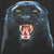 Close-up of snarling black panther print with yellow eyes and exposed fangs