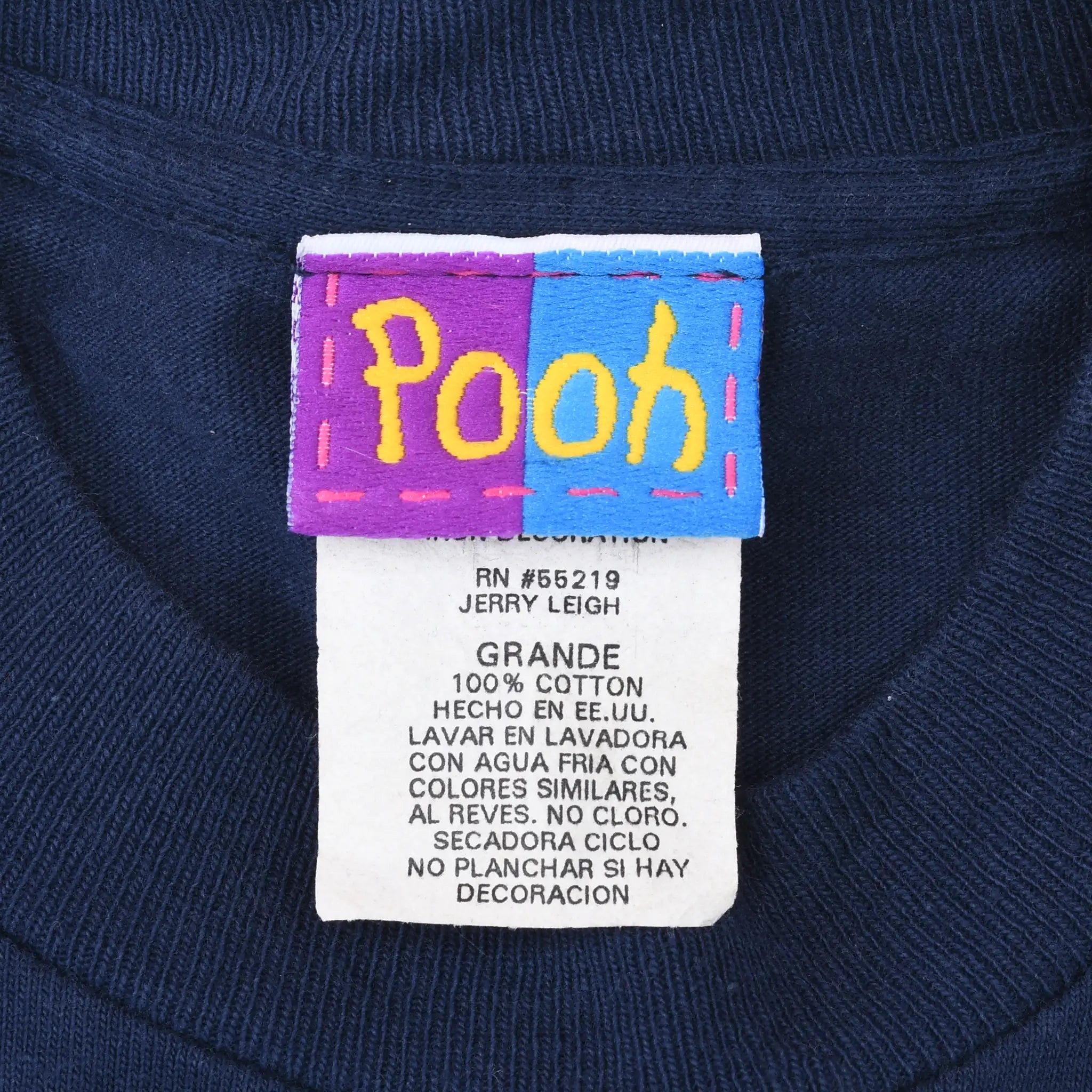 Pooh neck tag and care label on navy T-shirt