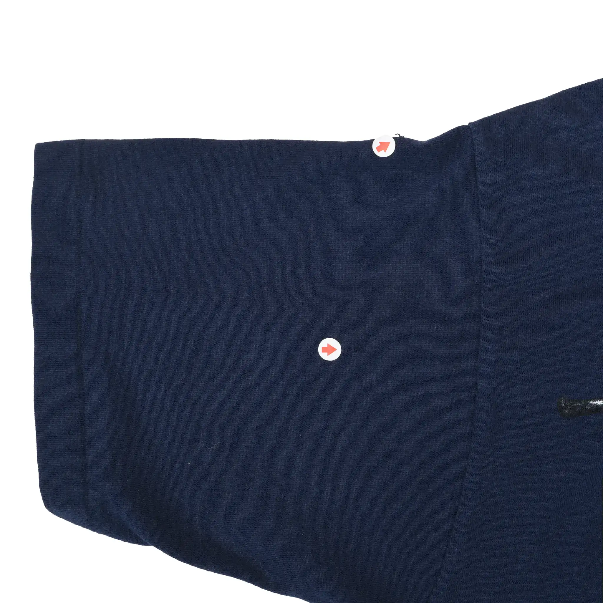 Close-up of navy T-shirt sleeve stitching marked with arrows