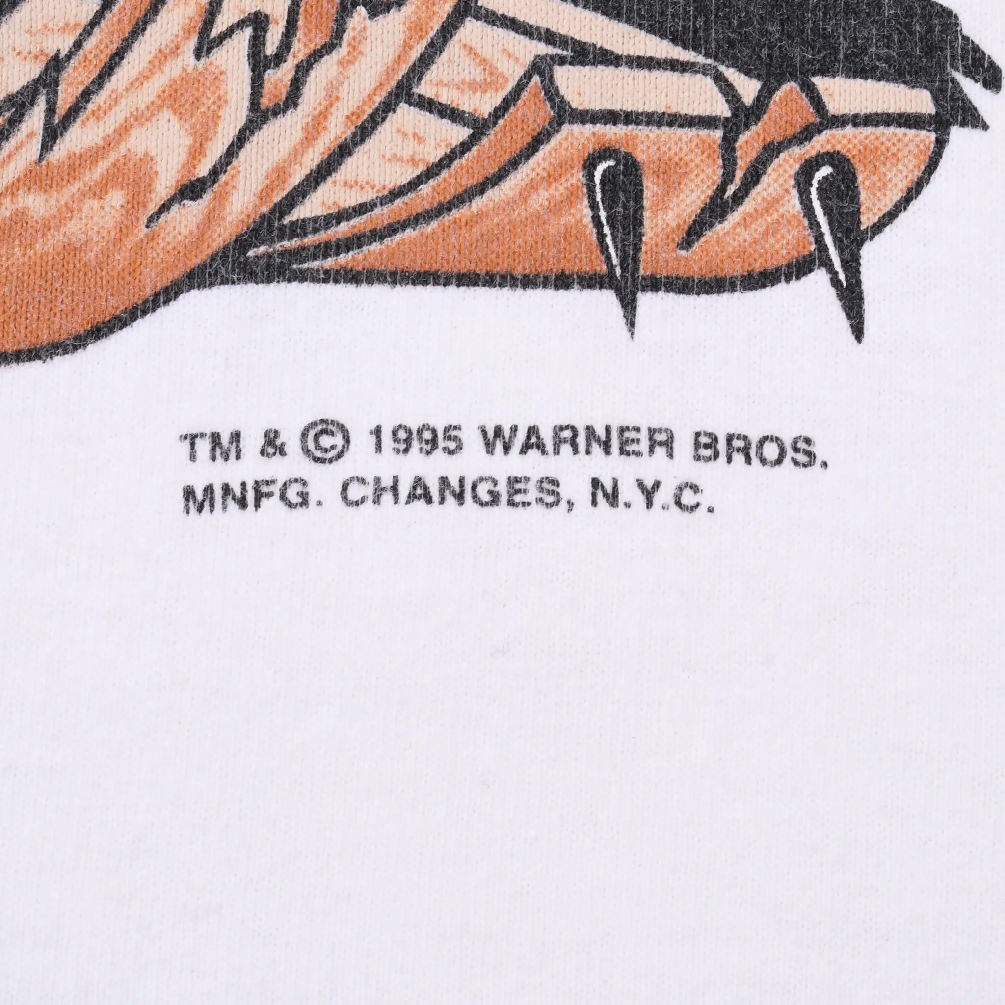 Close-up of 1995 Warner Bros. copyright print beneath the Taz graphic