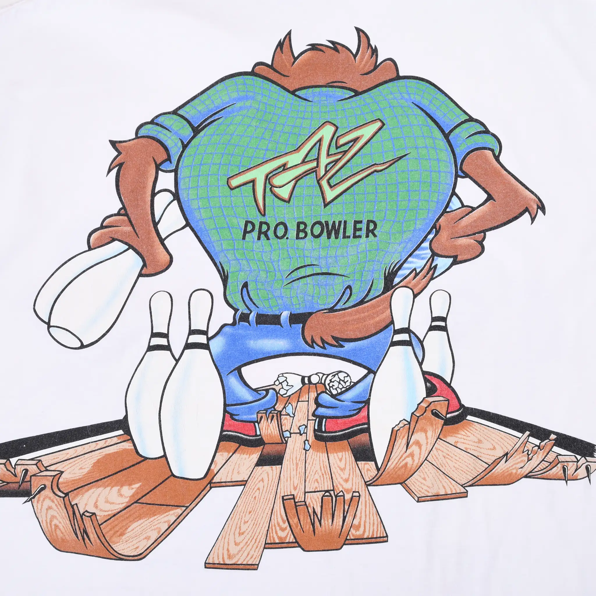 Close-up of back graphic showing Taz Pro Bowler shirt, bowling pins and broken lane
