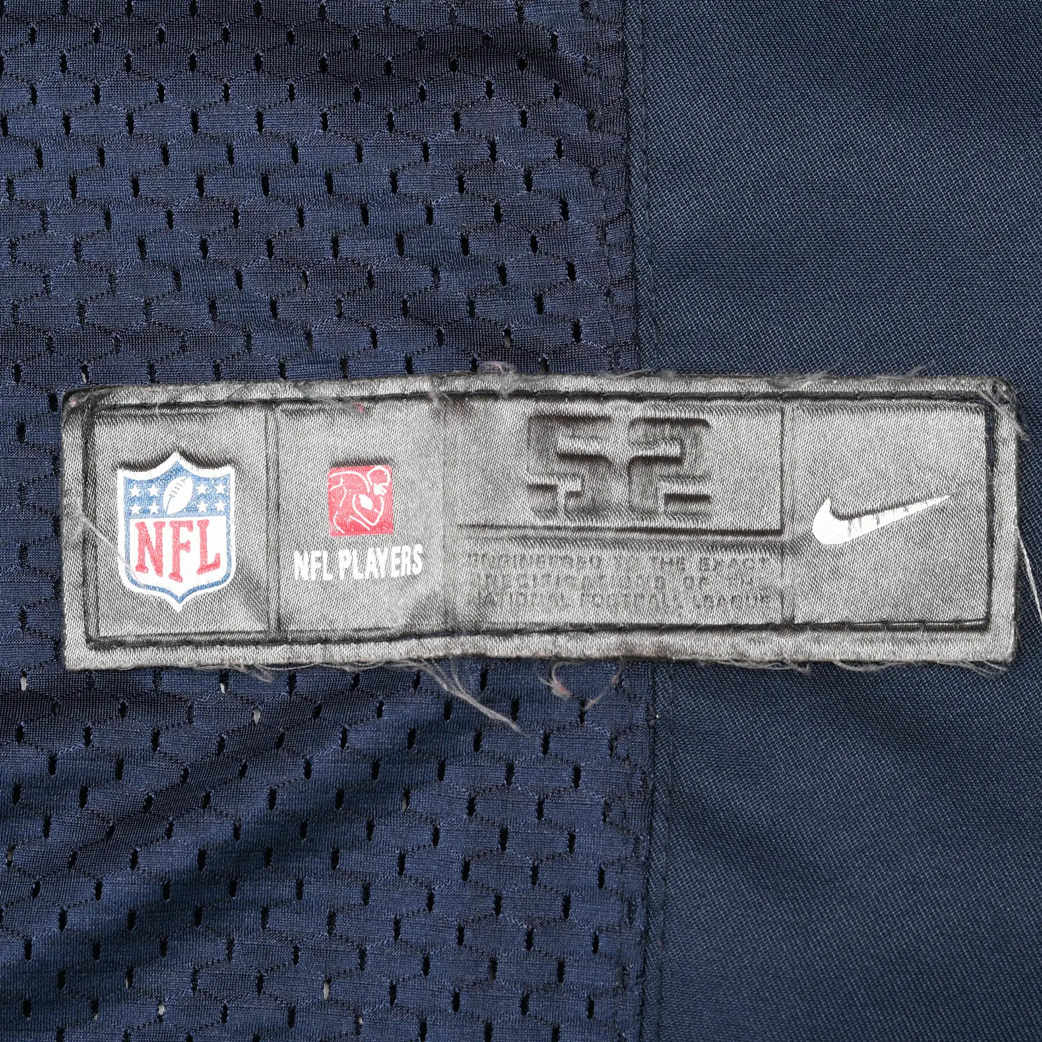 Close-up of NFL Players and Nike lower hem label on navy mesh jersey