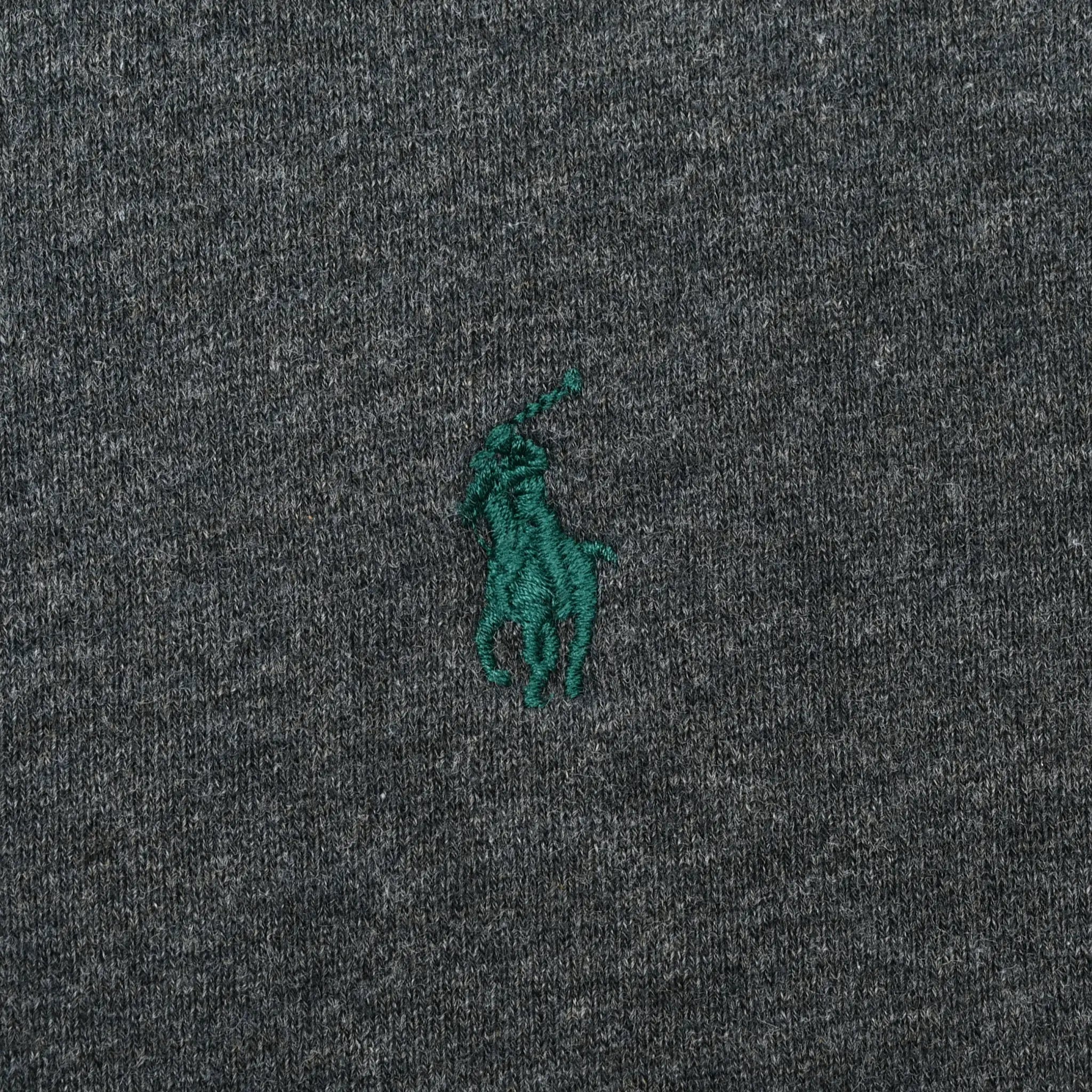 Close-up of green Polo pony embroidery on dark grey sweatshirt