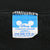 Close-up of Disney Character Fashions neck label marked One Size Fits All and Made in U.S.A.