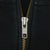 Close-up of YKK metal quarter-zip closure on black Polo Ralph Lauren sweatshirt
