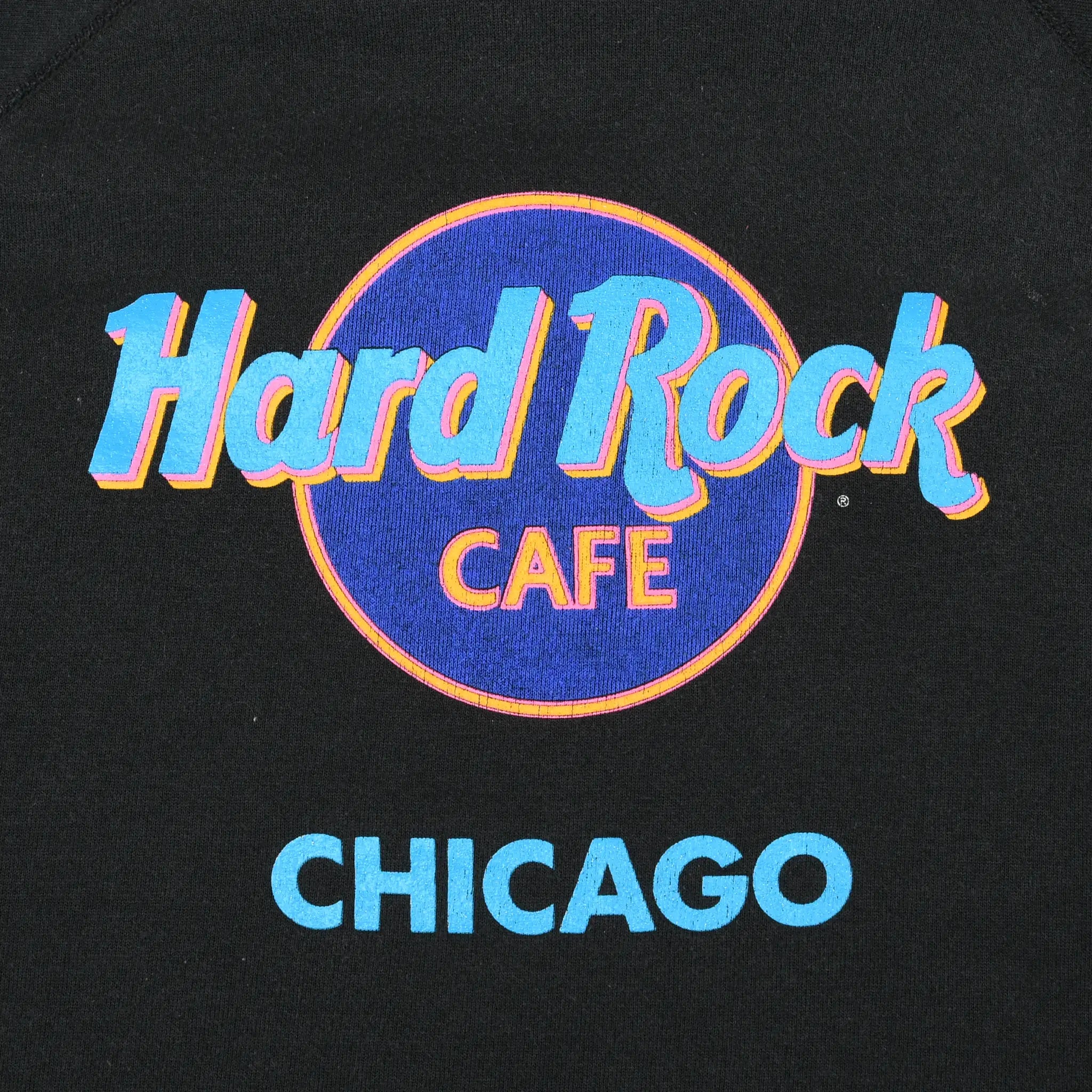 Close-up of colorful Hard Rock Cafe Chicago chest graphic on black sweatshirt