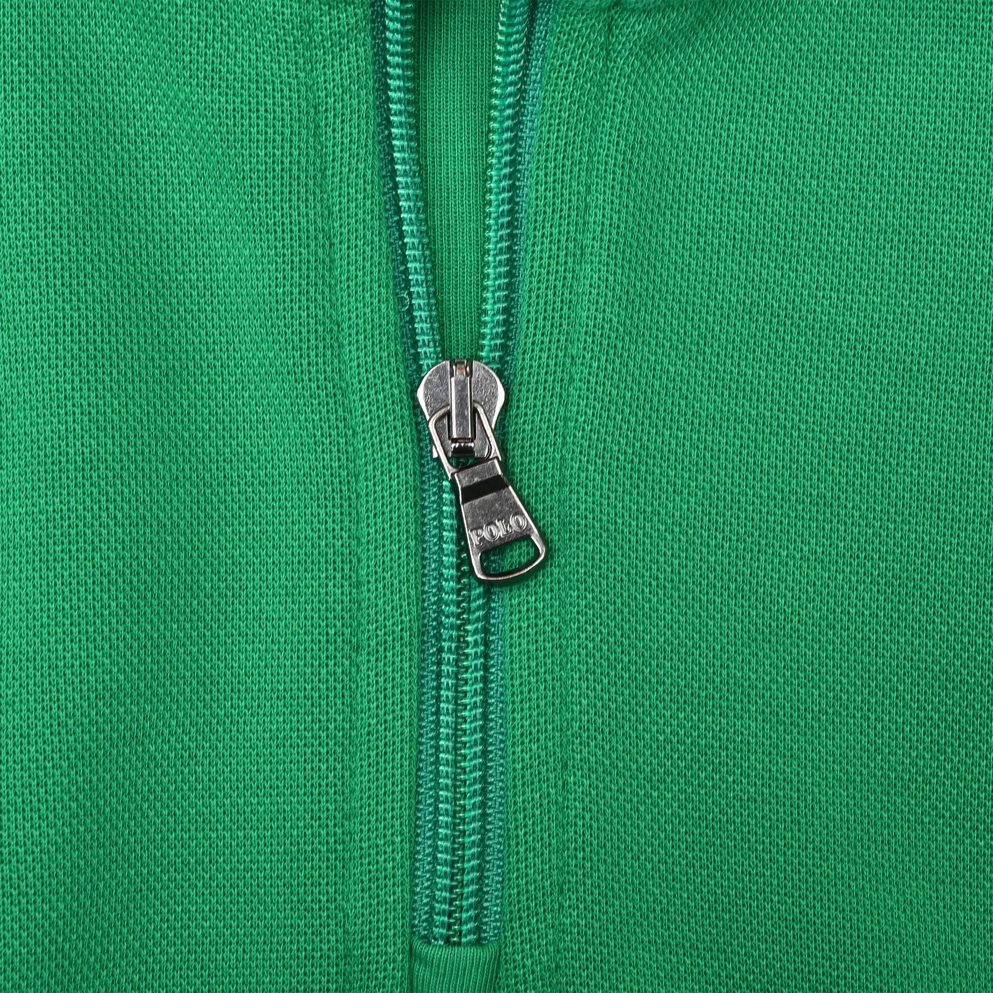 Close-up of metal quarter-zip closure on green Polo Ralph Lauren sweater