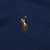 Close-up of multicolor Polo pony embroidery on navy blue sweater
