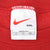 Nike neck tag showing red Swoosh, XXL size, and Made in USA text