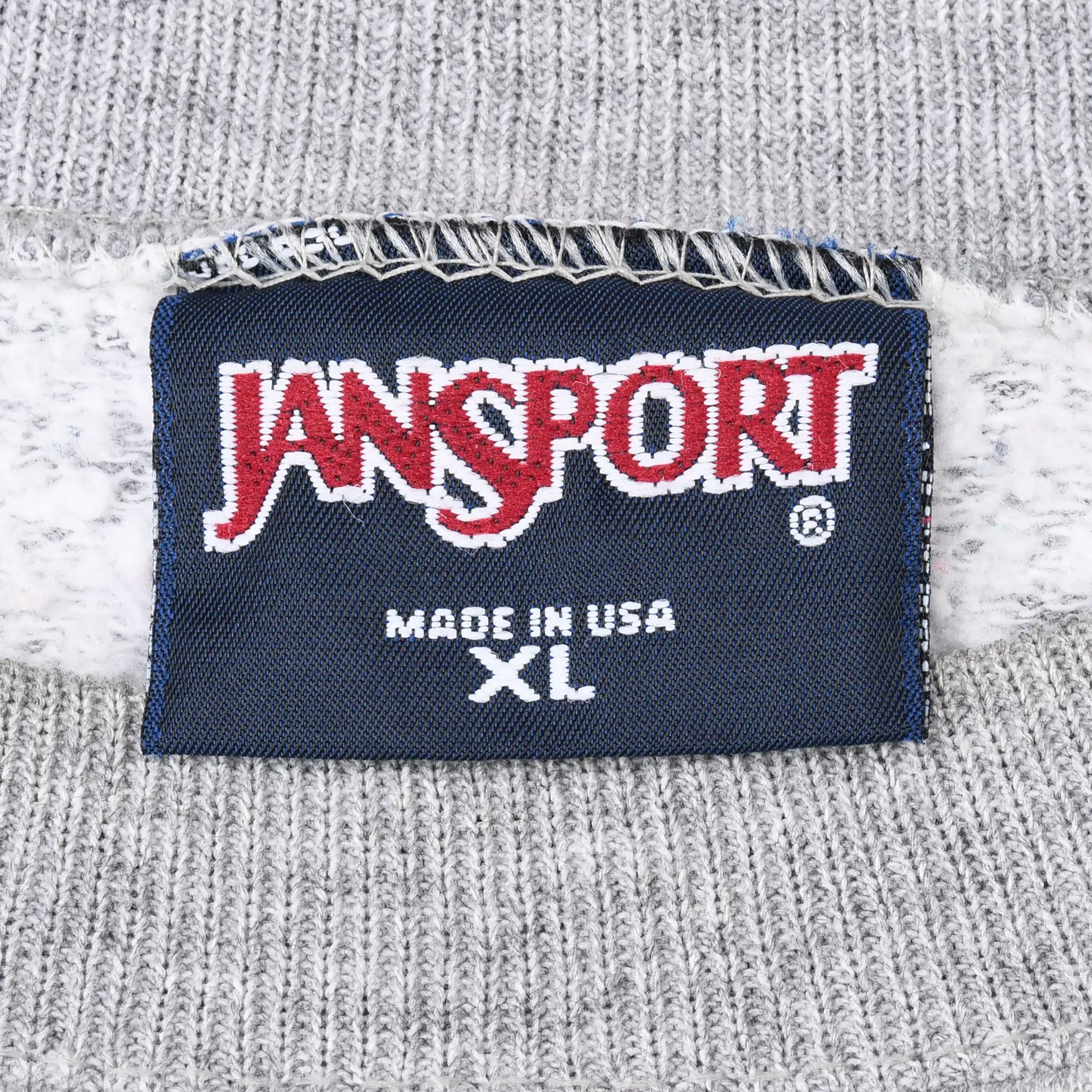 Close-up of Jansport XL Made in USA neck label