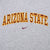 Close-up of maroon and gold Arizona State lettering with Nike Swoosh