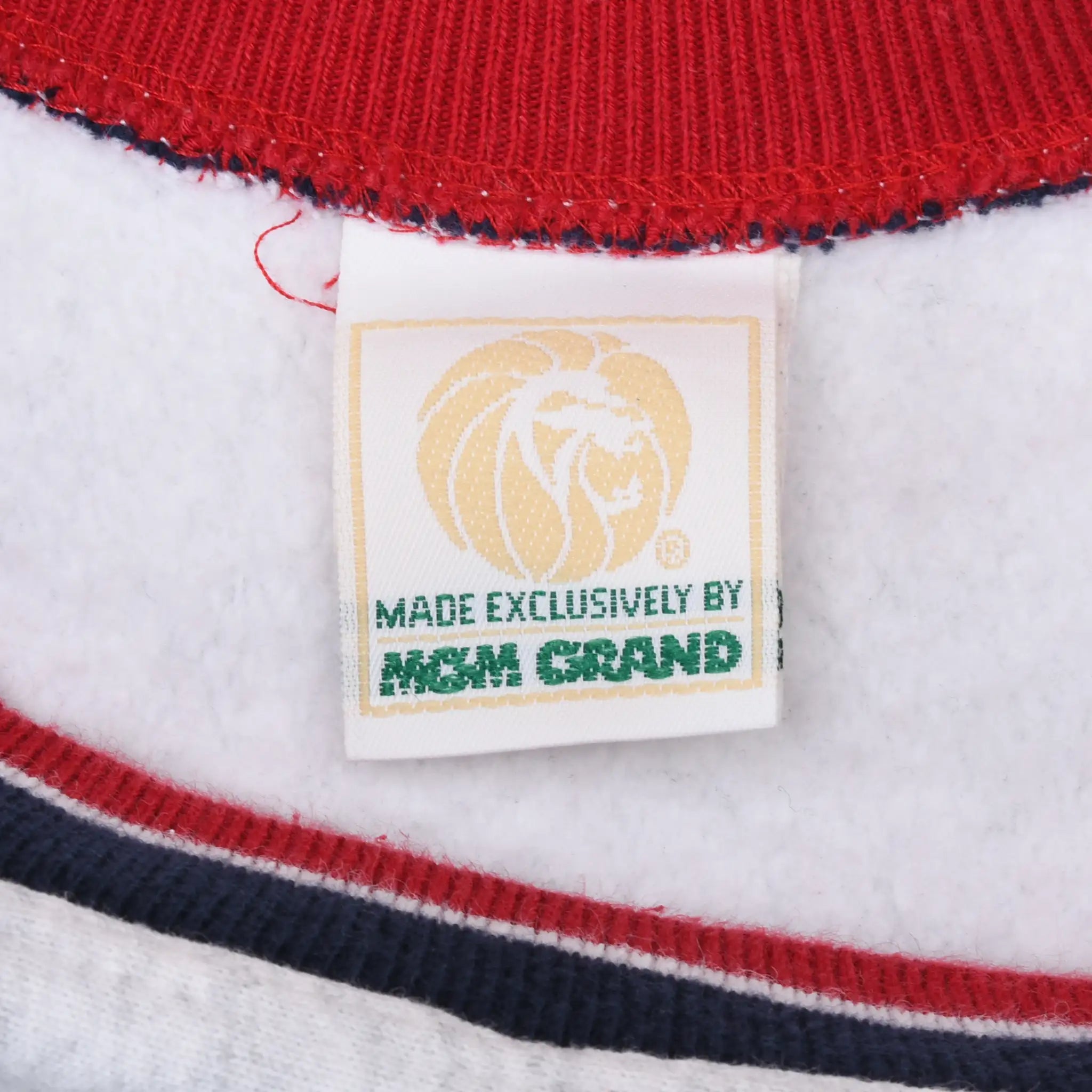 MGM Grand lion neck label reading Made Exclusively by MGM Grand