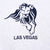 Close-up of navy MGM Grand lion embroidery above Las Vegas text