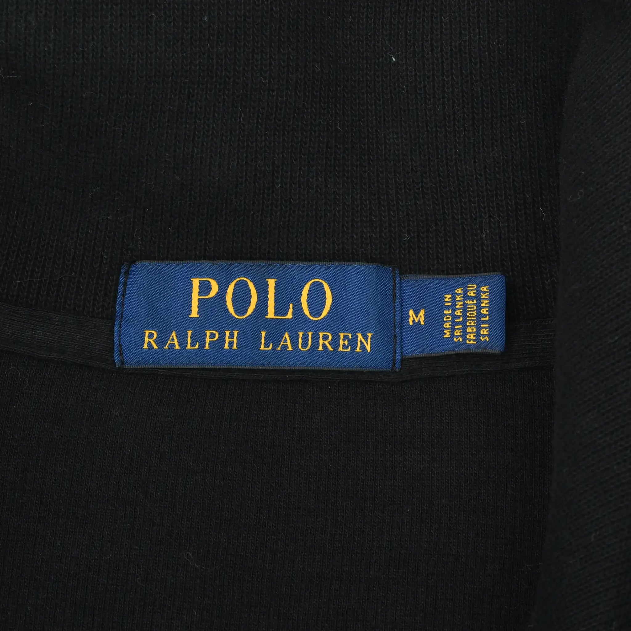 Polo Ralph Lauren neck label with medium size tag on black sweater