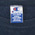 Champion XX-Large neck tag inside navy blue sweatshirt