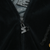 Close-up of black zipper with Starter star logo pull on velvet hoodie