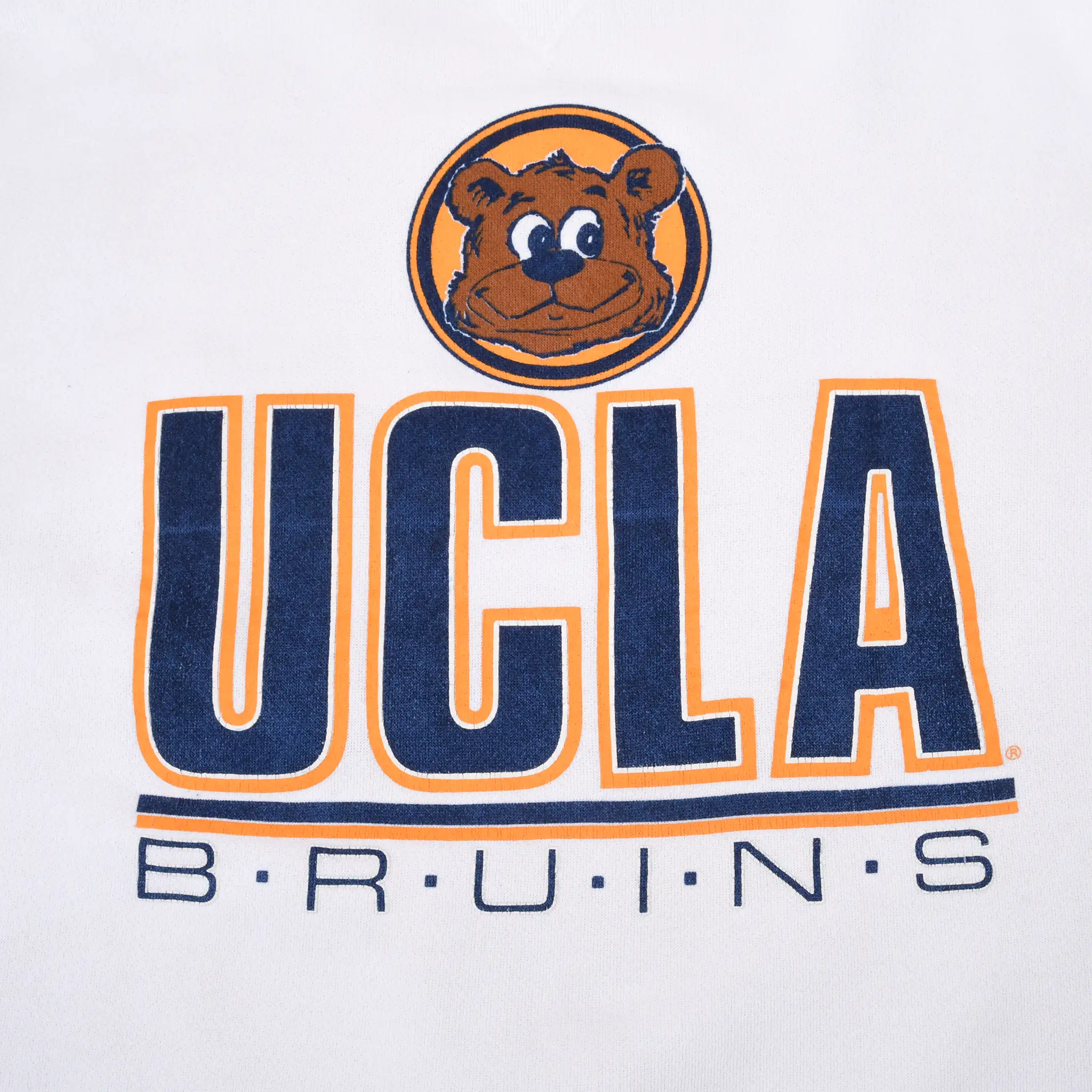 Close-up of UCLA Bruins bear mascot and navy-and-gold chest graphic