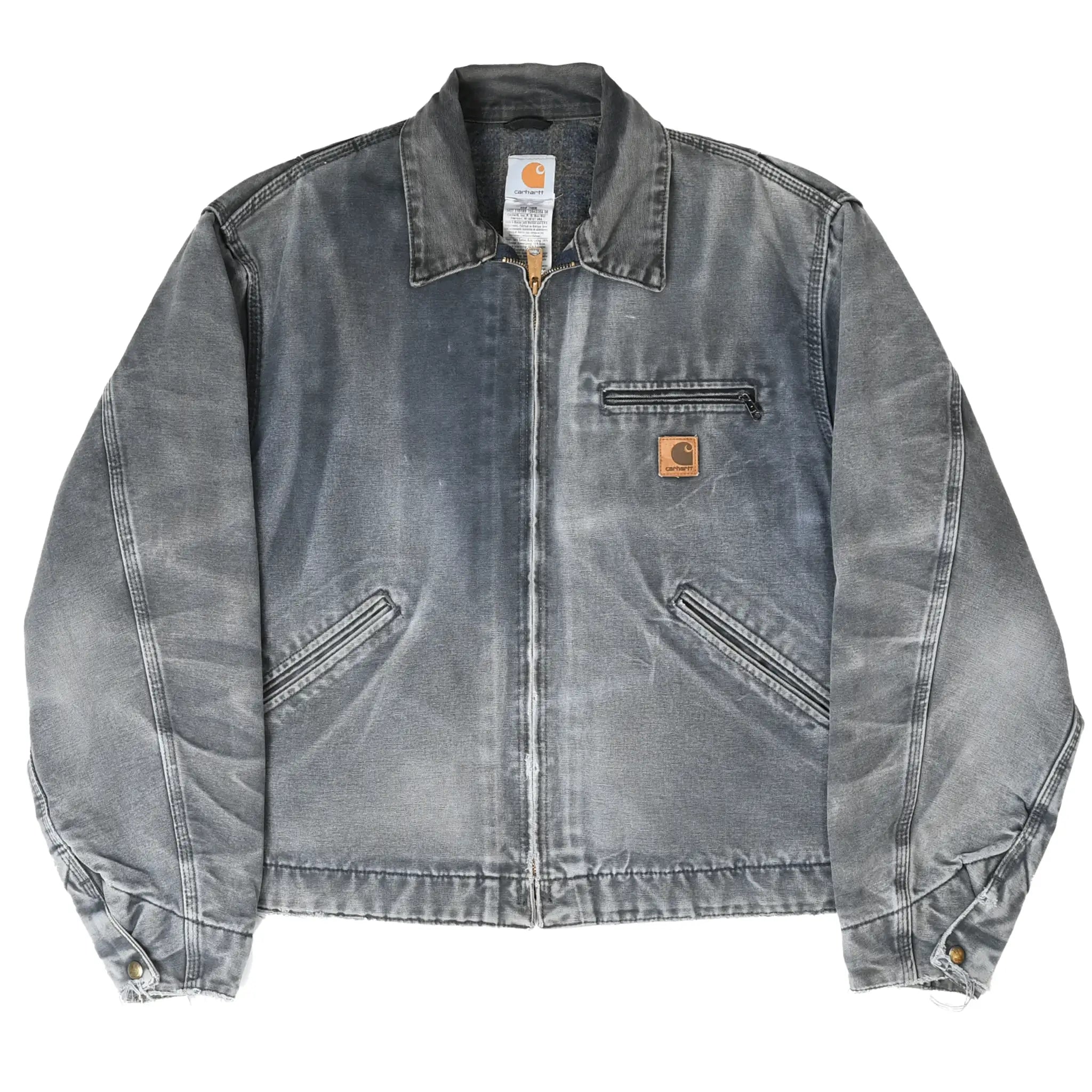 Full front of faded gray Carhartt Detroit jacket with three pockets and logo patch