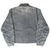 Back of faded gray Carhartt Detroit jacket with pronounced sleeve whiskering