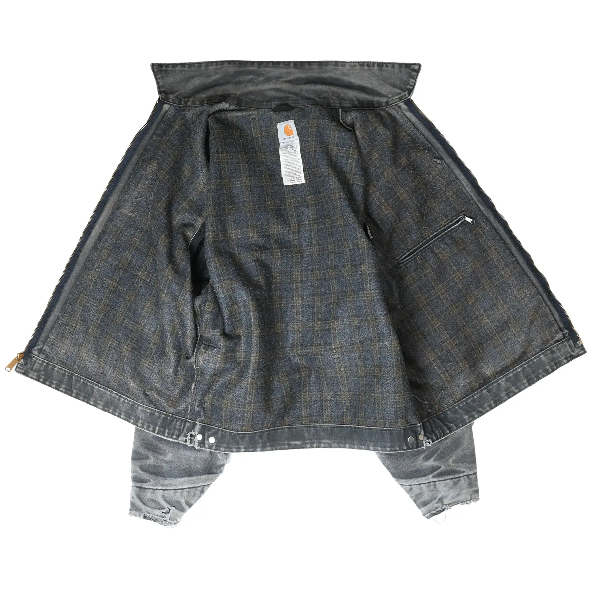 Open Carhartt Detroit jacket showing dark plaid lining, interior pocket, and label