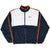 Full front of navy, white and orange Nike zip-up windbreaker with elastic cuffs and hem