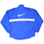 Back of blue Nike pullover windbreaker with large white Swoosh and horizontal stripe