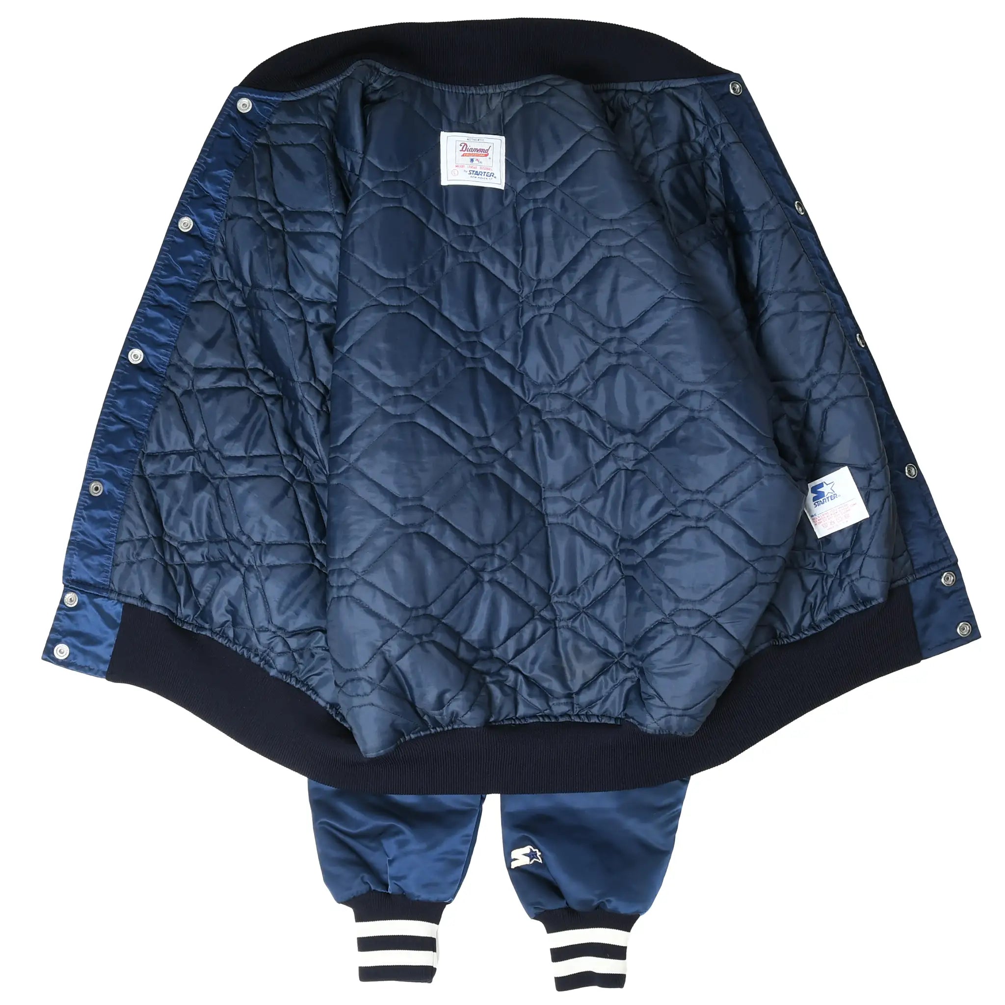 Open New York Yankees Starter jacket showing navy quilted lining and interior labels