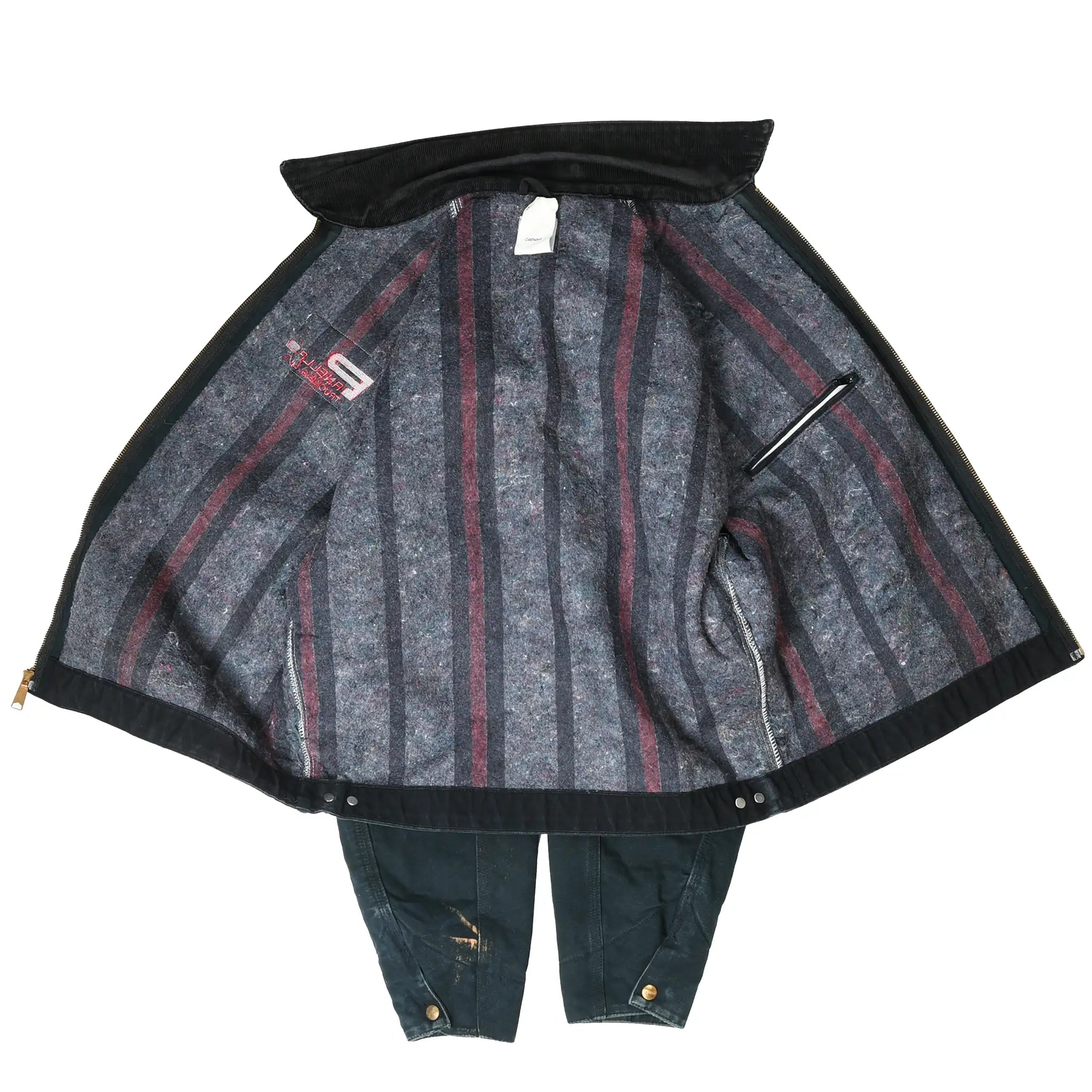 Open black Carhartt Detroit jacket showing gray blanket lining with red stripes