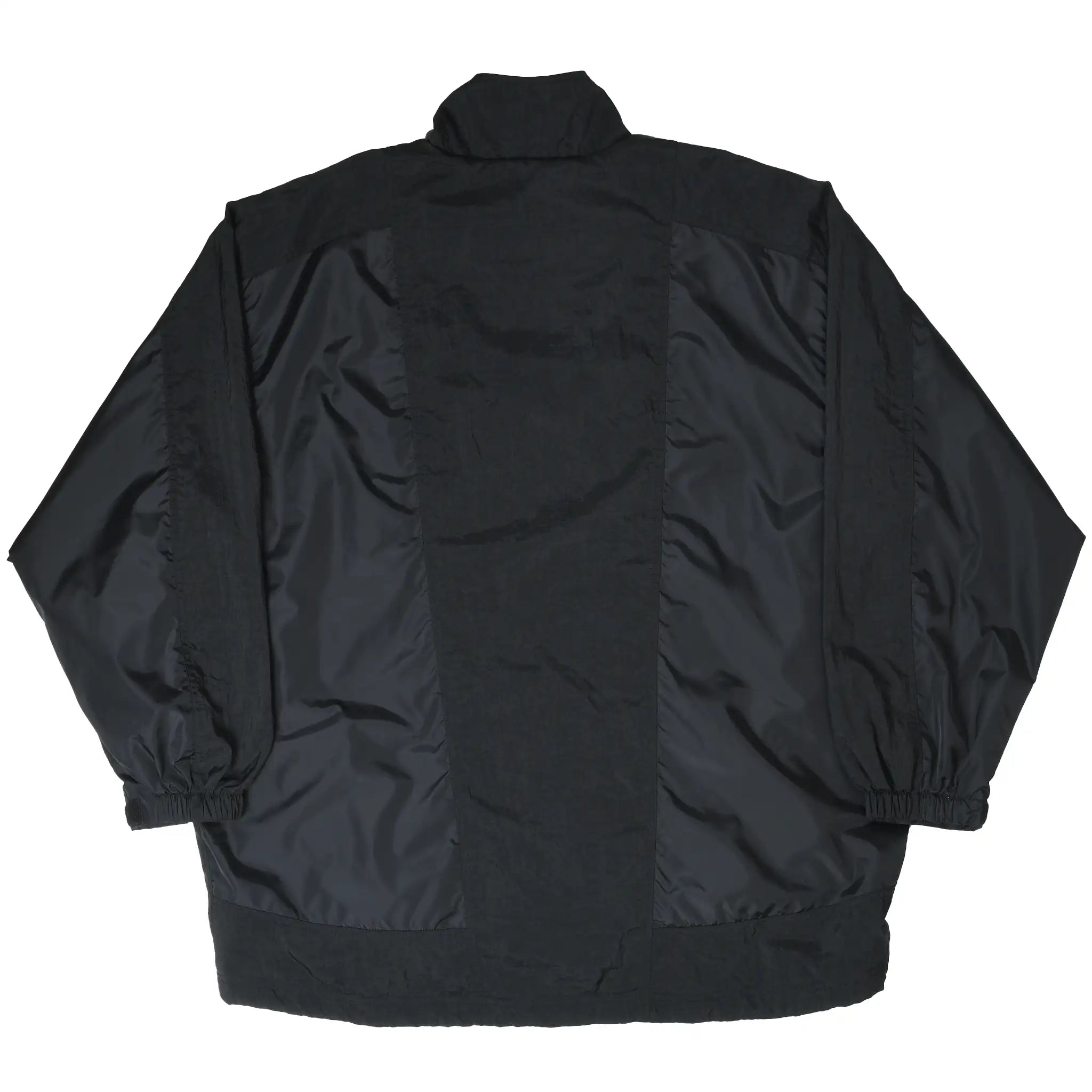 Back of black Nike windbreaker jacket with paneled design and elastic cuffs
