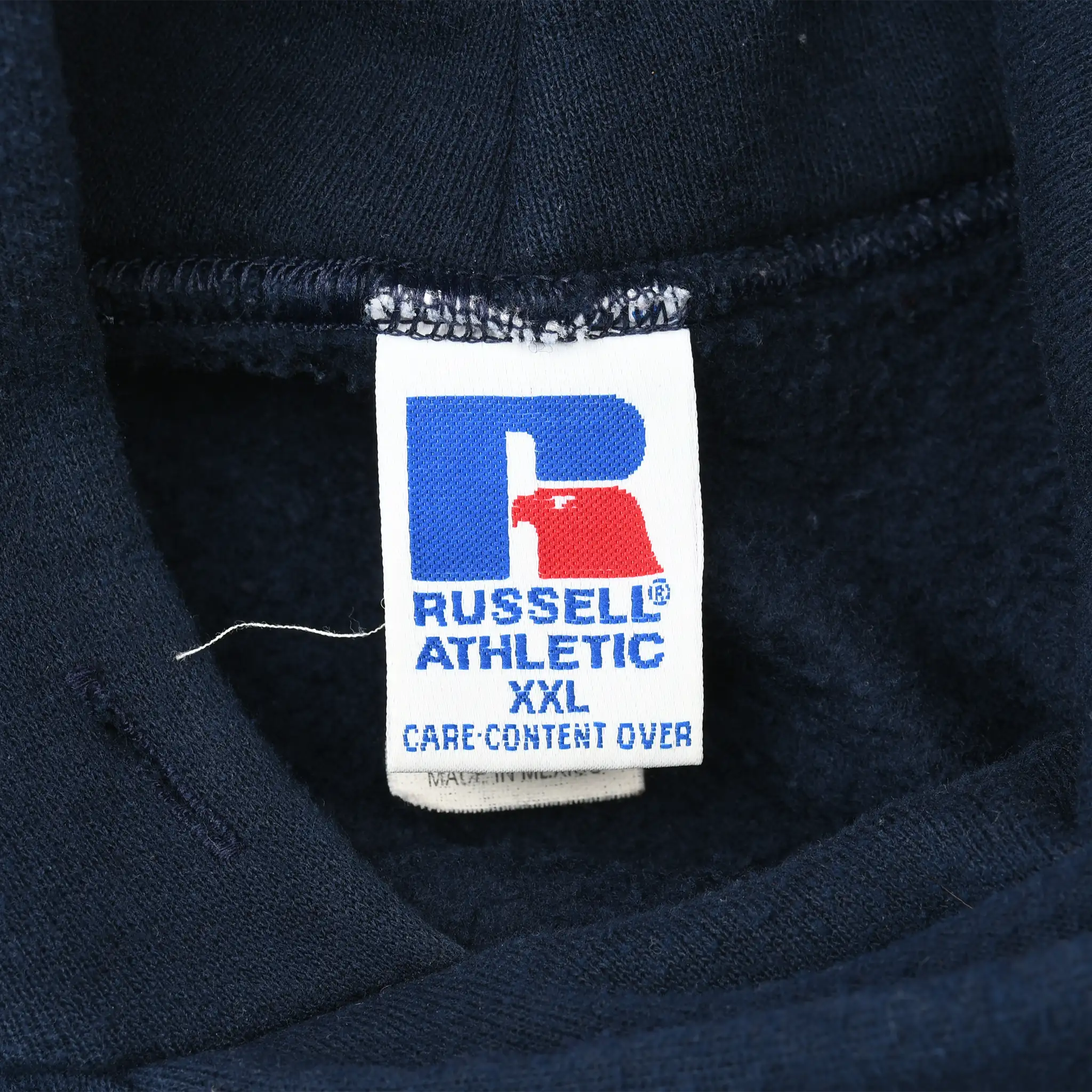 Russell Athletic XXL care content label inside navy blue hoodie