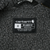 Carhartt interior label showing small size and relaxed fit against gray sherpa lining