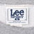 Close-up of Lee Sport neck label marked Made in USA on gray sweatshirt