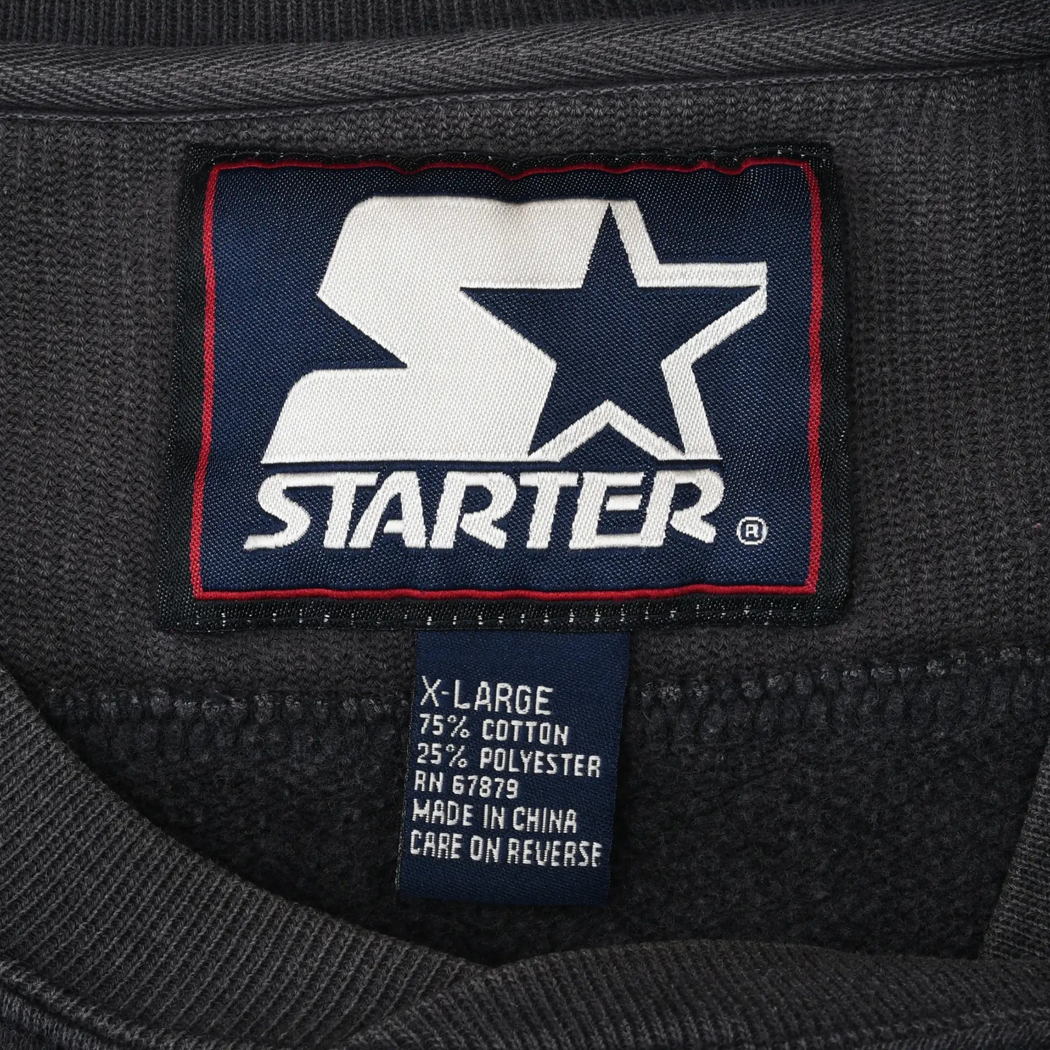 Close-up of Starter neck label and X-Large care tag inside sweatshirt