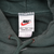Nike neck label on green hoodie showing XXL sizing and Made in U.S.A.
