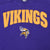 Close-up of gold Vikings lettering and embroidered Minnesota Vikings logo