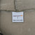 Carhartt interior label marked size L and Made in Nicaragua against beige fleece lining