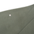 Close-up of olive green sleeve fabric with an arrow marking a small spot