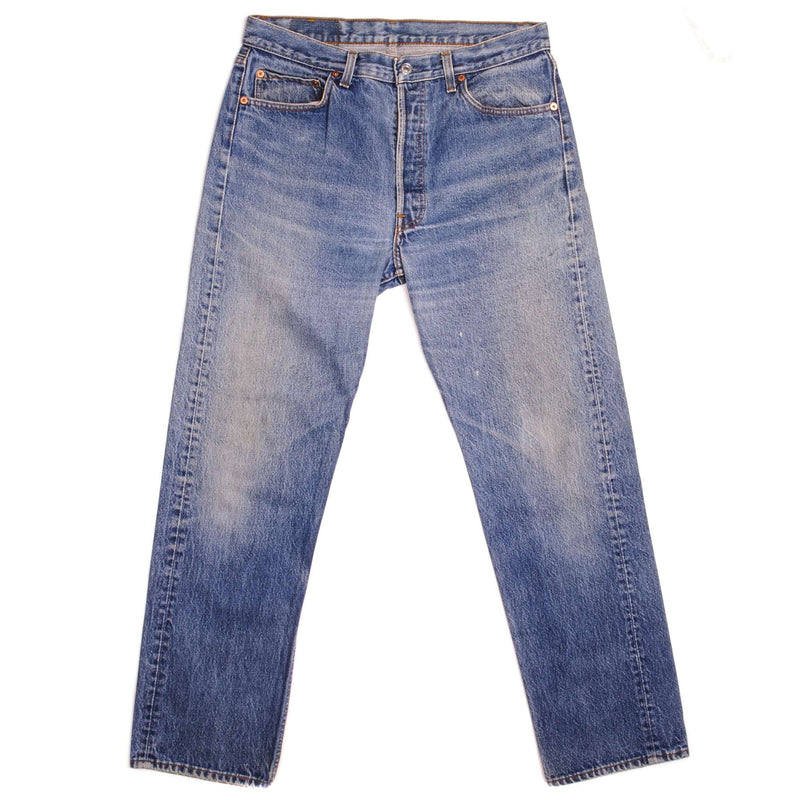 Beautiful Indigo Levis 501 Jeans 1988-1993 Made in USA with a medium blue wash, a nice contrast of light and medium blue and some strong whiskers.  Size on Tag 35X34  ACTUAL SIZE 34X30  Back Button #524