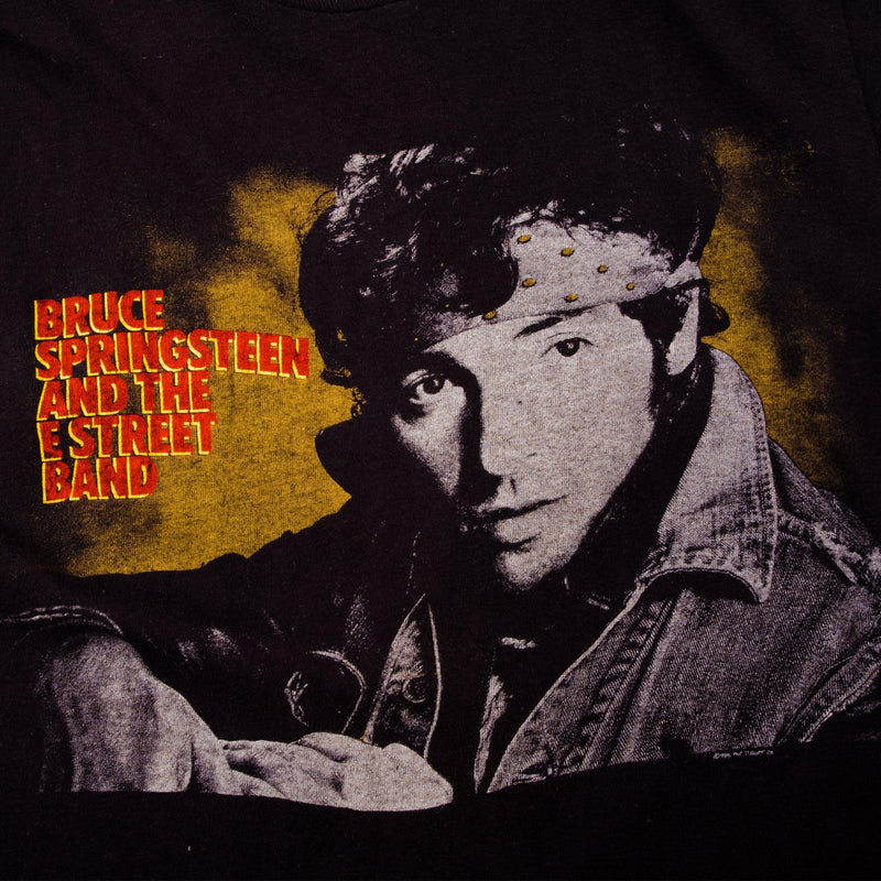 Vintage Bruce Springsteen And The E Street Band Screen Stars Blue Tee Shirt 1985 Size Small Made In USA with single stitch sleeves.