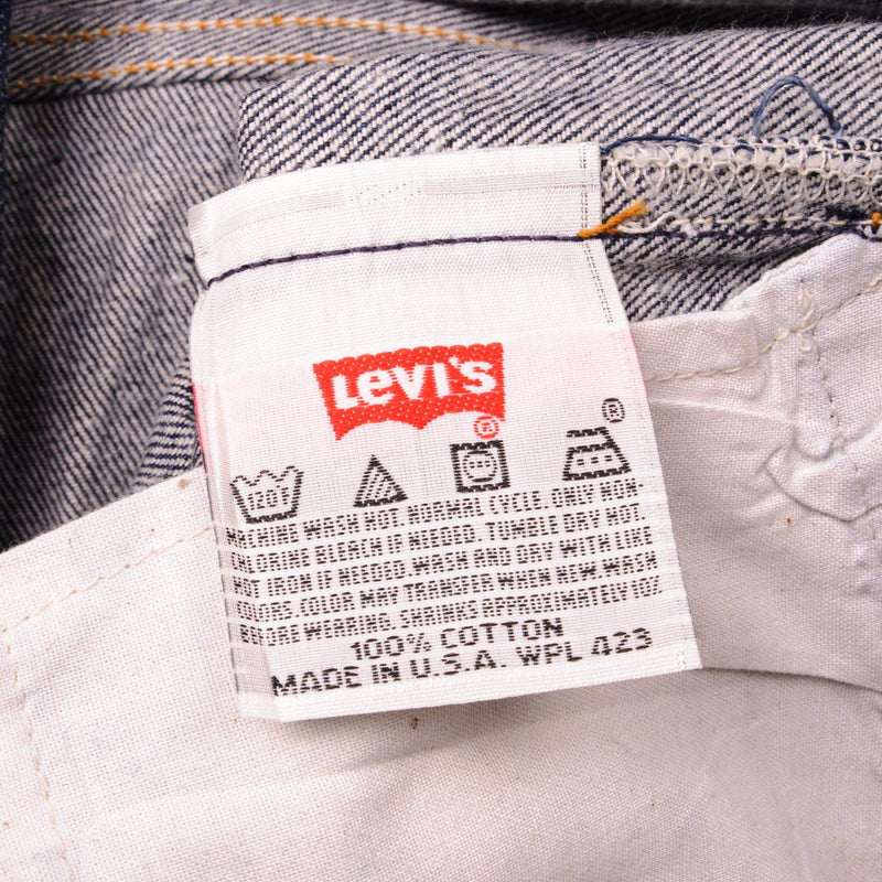 Beautiful Indigo Levis 501 Jeans 1990s Made in USA with a very dark wash.  Size on Tag 40X34  ACTUAL SIZE 38X32  Back Button #552