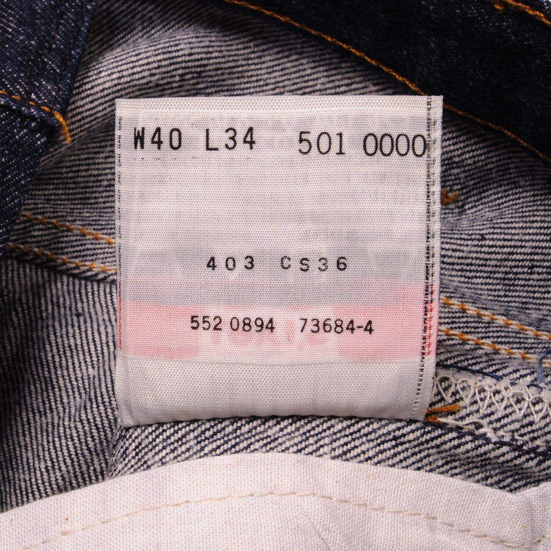 Beautiful Indigo Levis 501 Jeans 1990s Made in USA with a very dark wash.  Size on Tag 40X34  ACTUAL SIZE 38X32  Back Button #552